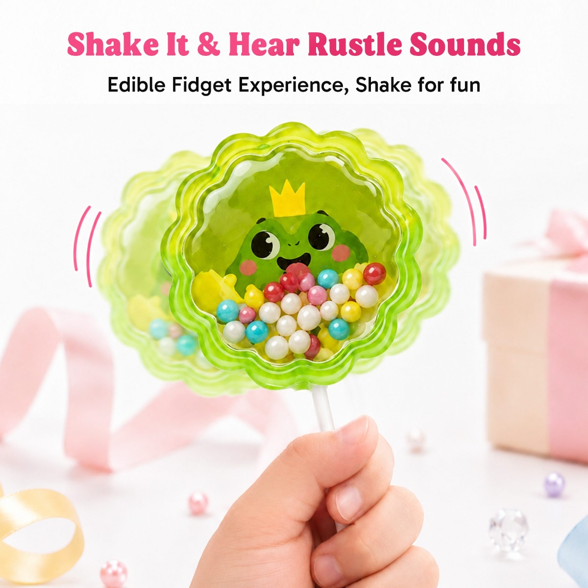 Close-up of a green frog-shaped Glimboo Magic Animal 5D lollipop with colorful candy pieces under a clear shell.