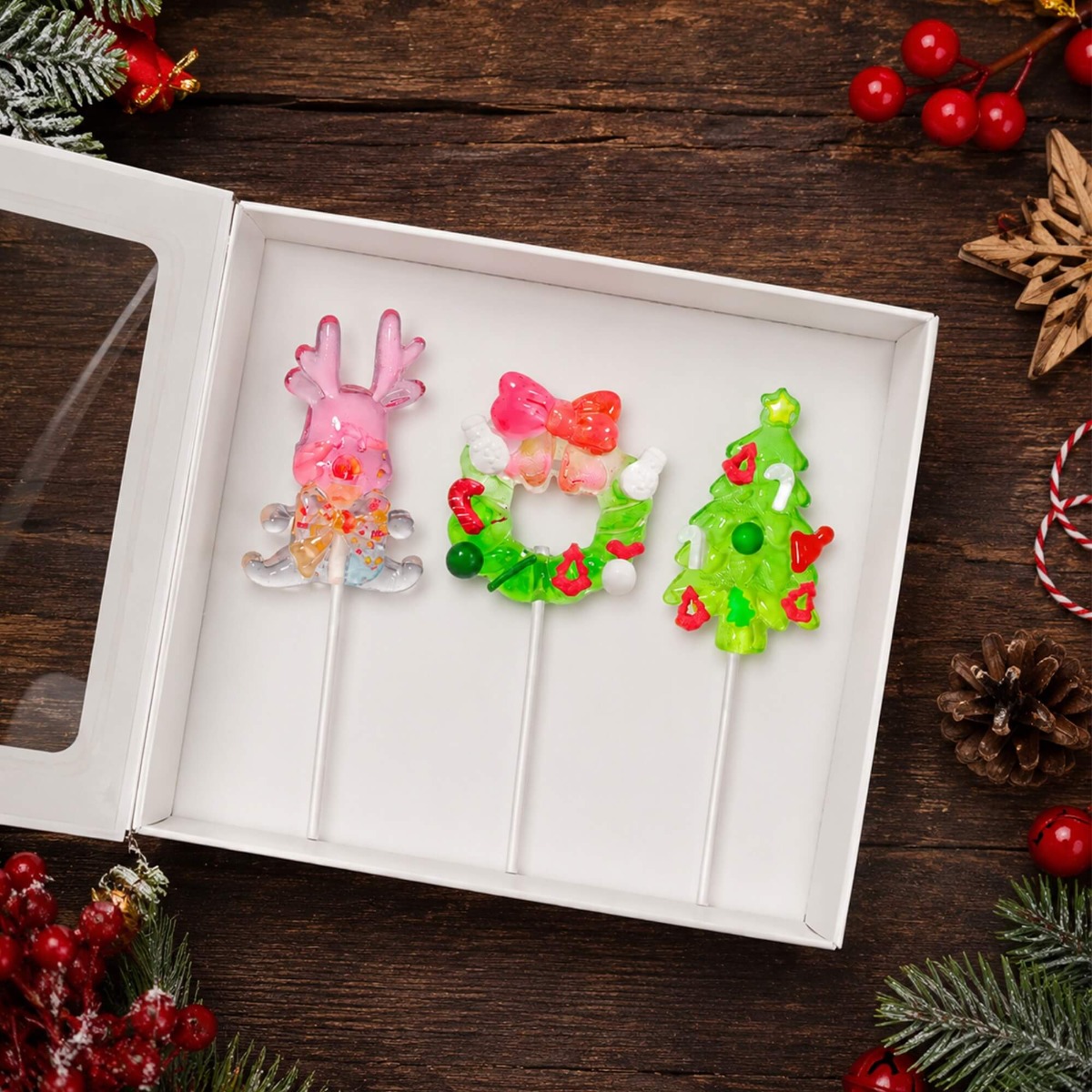 Glimboo Crystal Xmas Series handcrafted 3D art lollipops presented in a gift box with reindeer, wreath, and Christmas tree designs